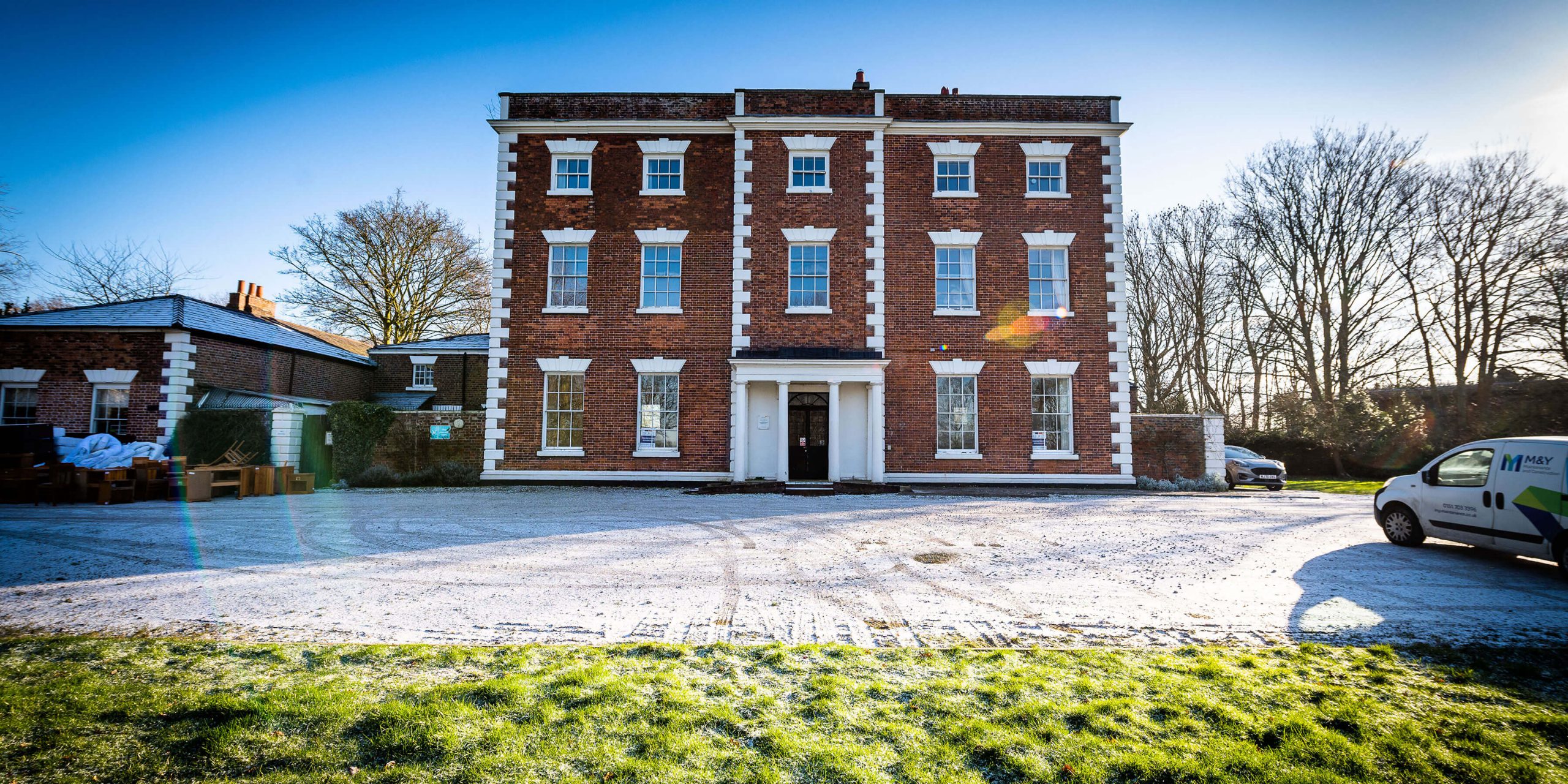 trafford hall building with m&y van