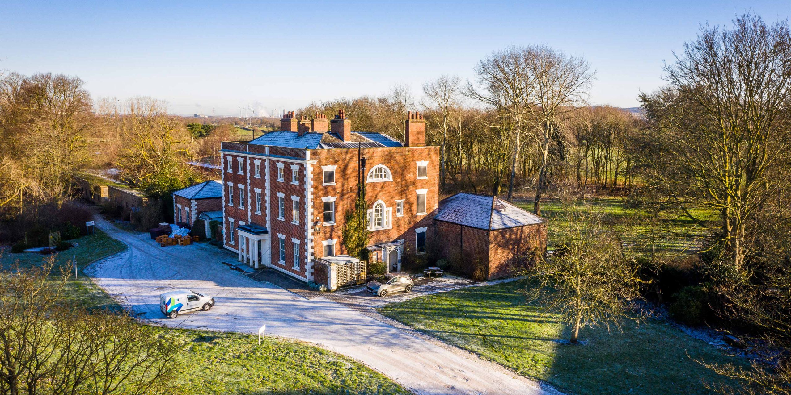 drone shot of the traffors hall building