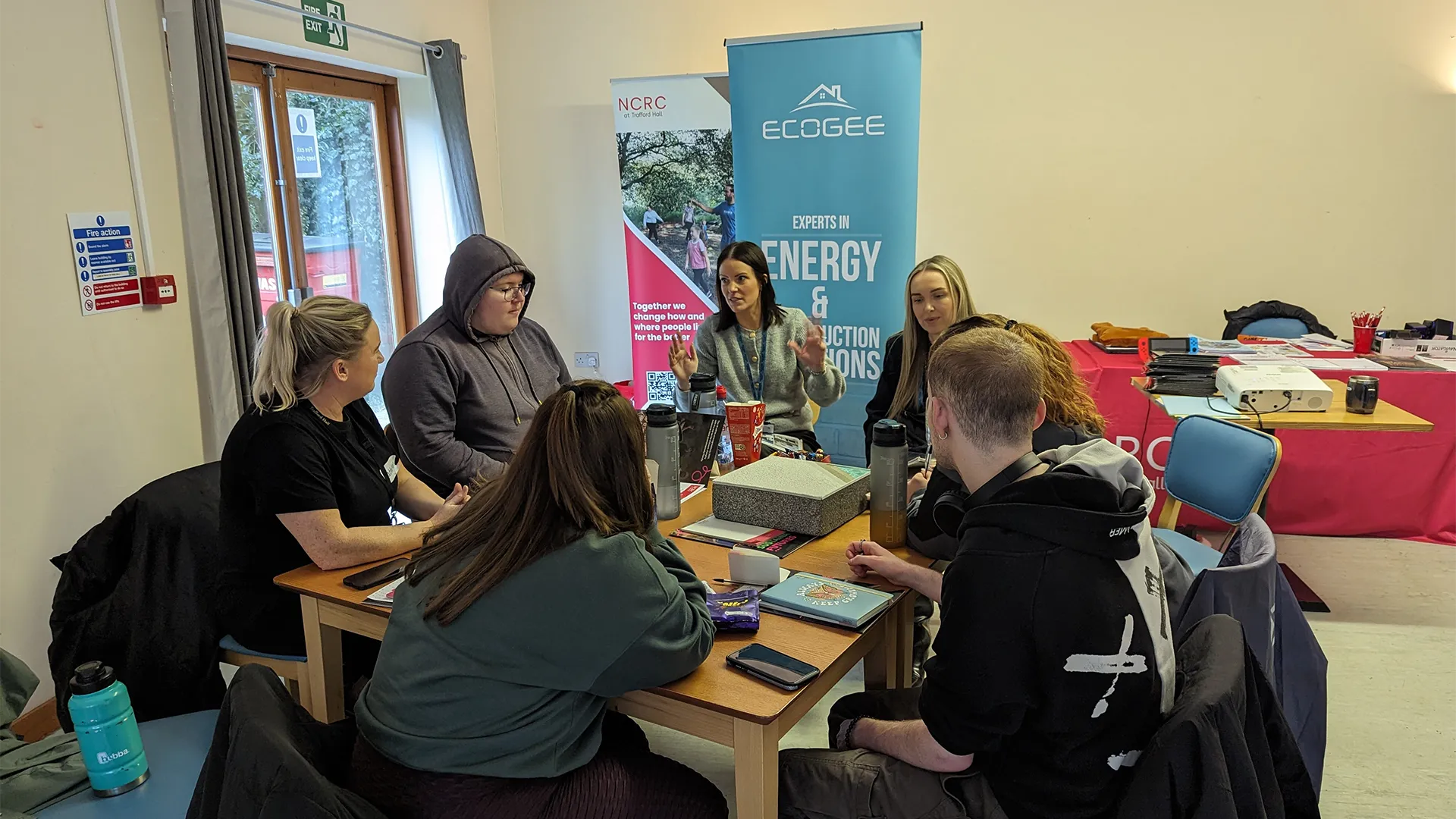 Young people learning around a table